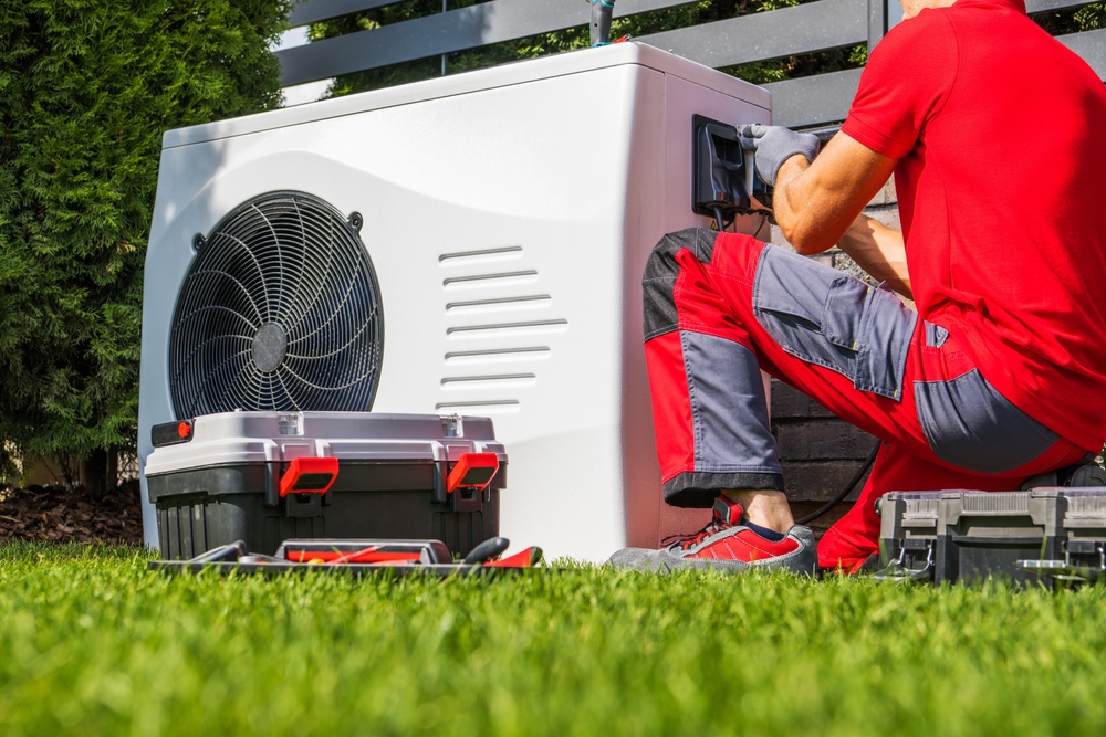 On The Double technician installing an HVAC system