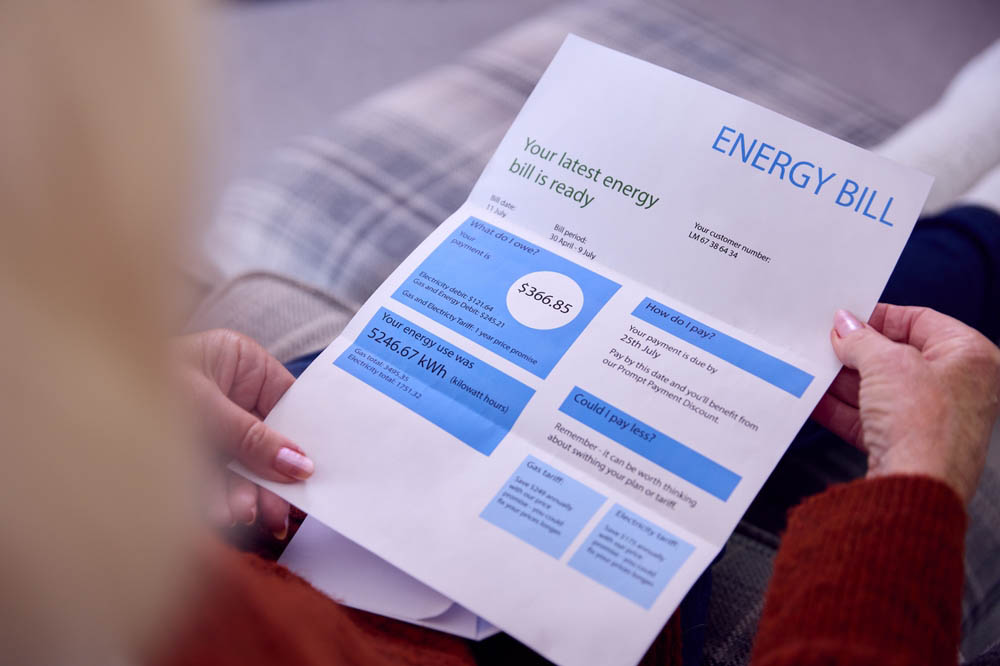 homeowner looking at energy bill
