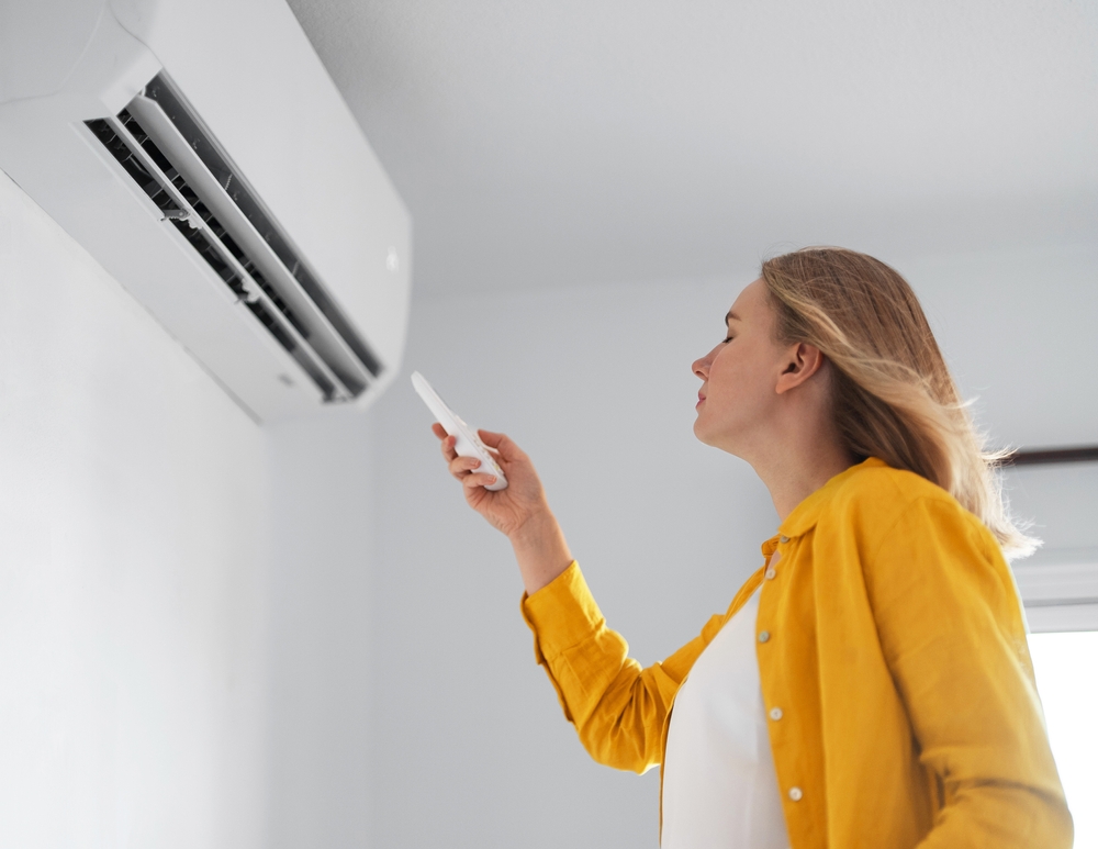 person in front of AC unit